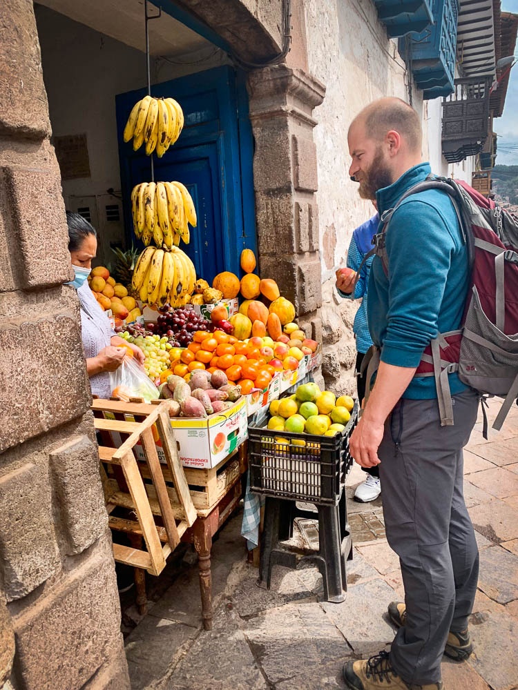 Krystof buys fruit from a small stall selling fruit